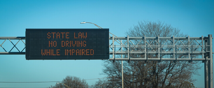 Sign in New York describing that drinking while driving is illegal
