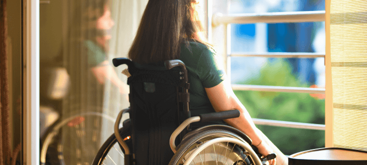 Woman in a wheelchair after paralysis from a personal injury accident.