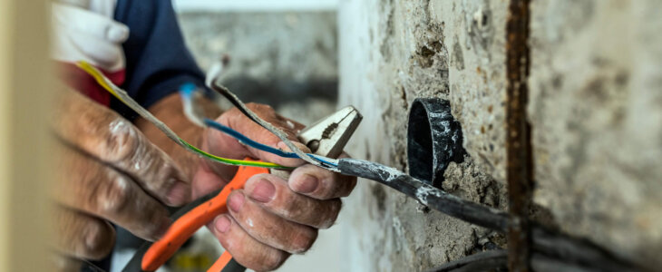 Construction worker handling electrical wires