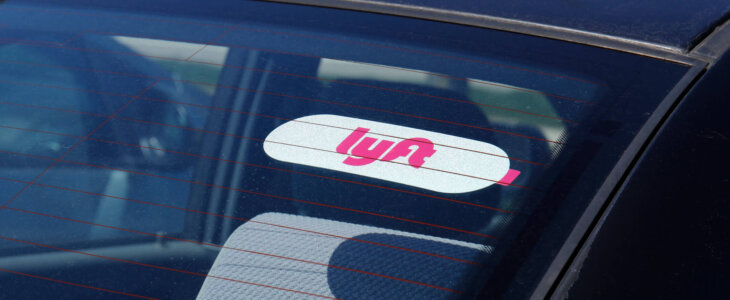 Car for hire with a Lyft sticker. Lyft and Uber have replaced many Taxi cabs for transportation with a smart phone app I