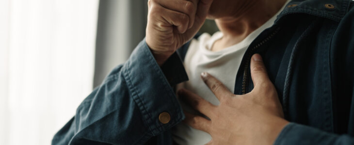 Young asian man was suffering from painful chest pain from a chronic disease.