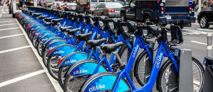 Row of blue Citi Bike bicycles docked on a New York City street