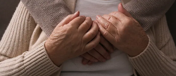 Young and elderly women hugging