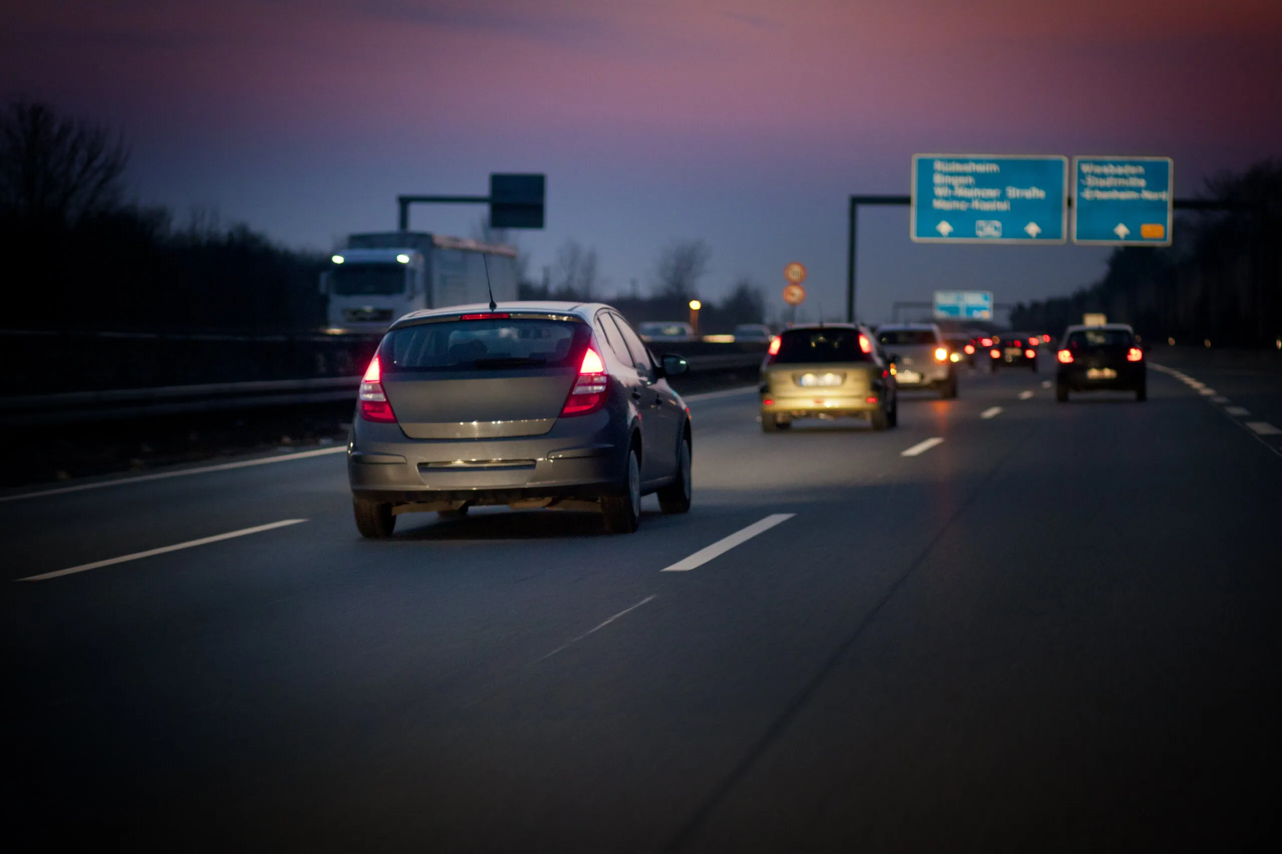 cars driving on a highway at night